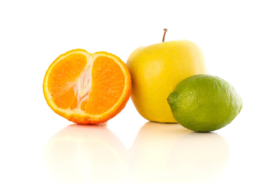 image of fruit: orange, apple, lime