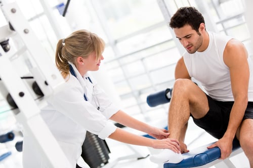 Patient seeing doctor for a rolled ankle