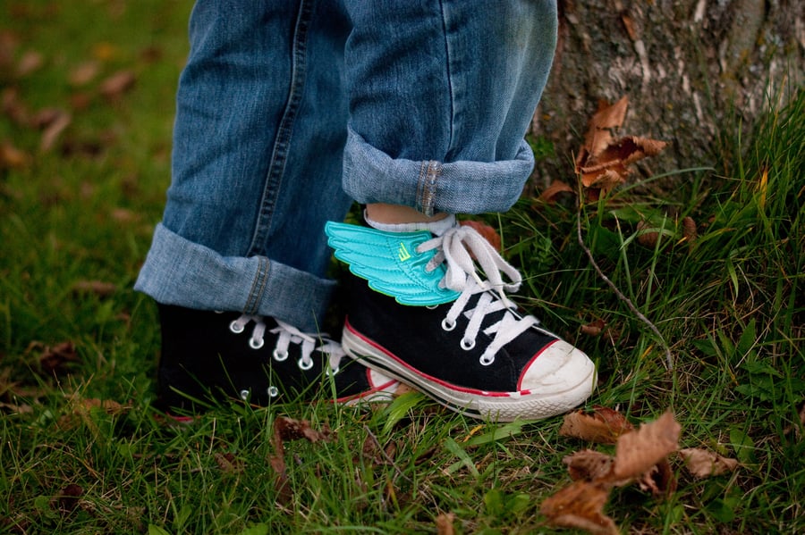 Sweeney Foot & Ankle Kids and Bunions Closeup of Young Child in Shoes with Wings in Grass