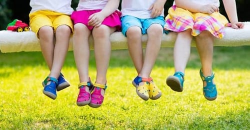 Kids with colorful shoes on