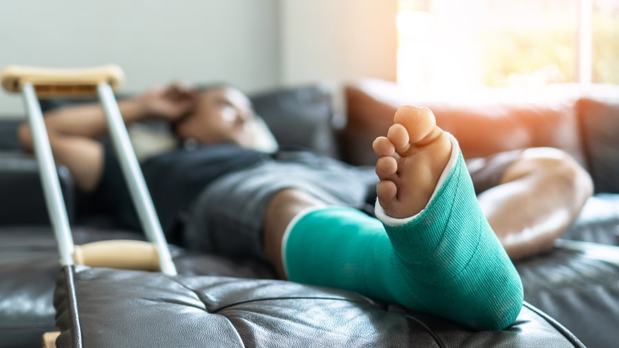 Man laying down with cast