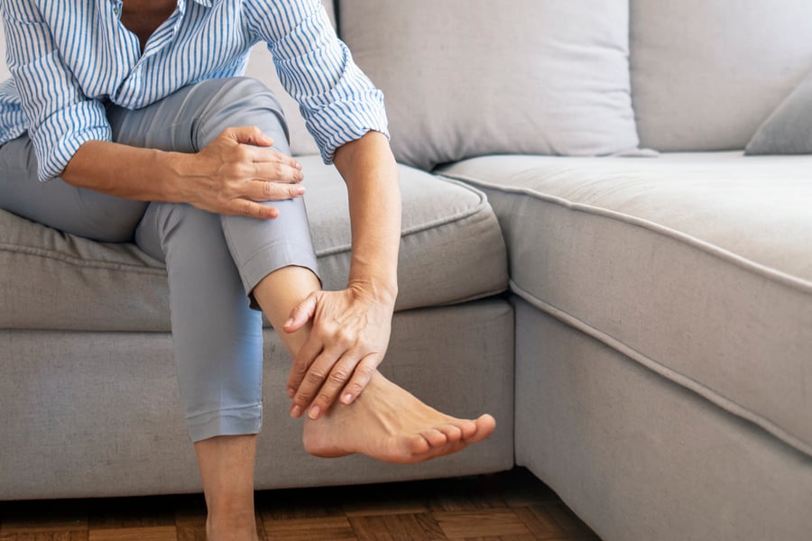 Woman feeling pain in her foot