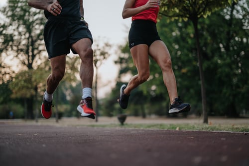 Couple jogging in park at evening