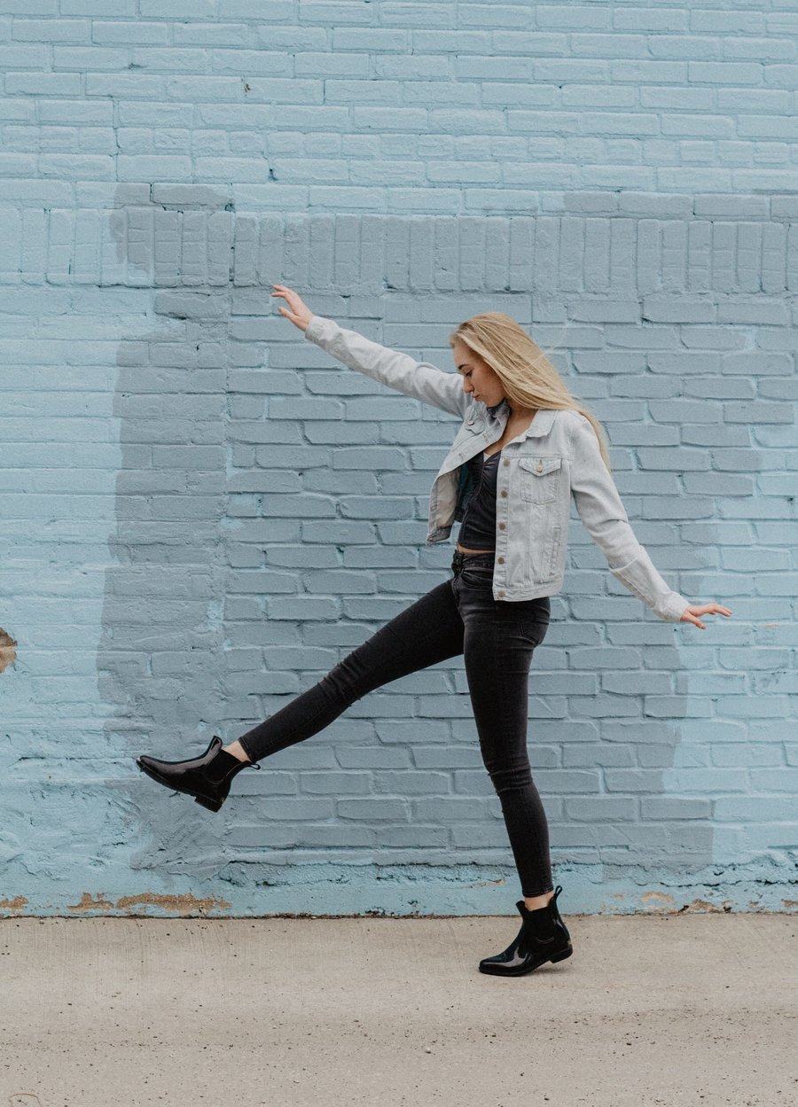 Sweeney Foot and Ankle What is Pronation Happy Girl Walking Boldly By Painted Brick Wall